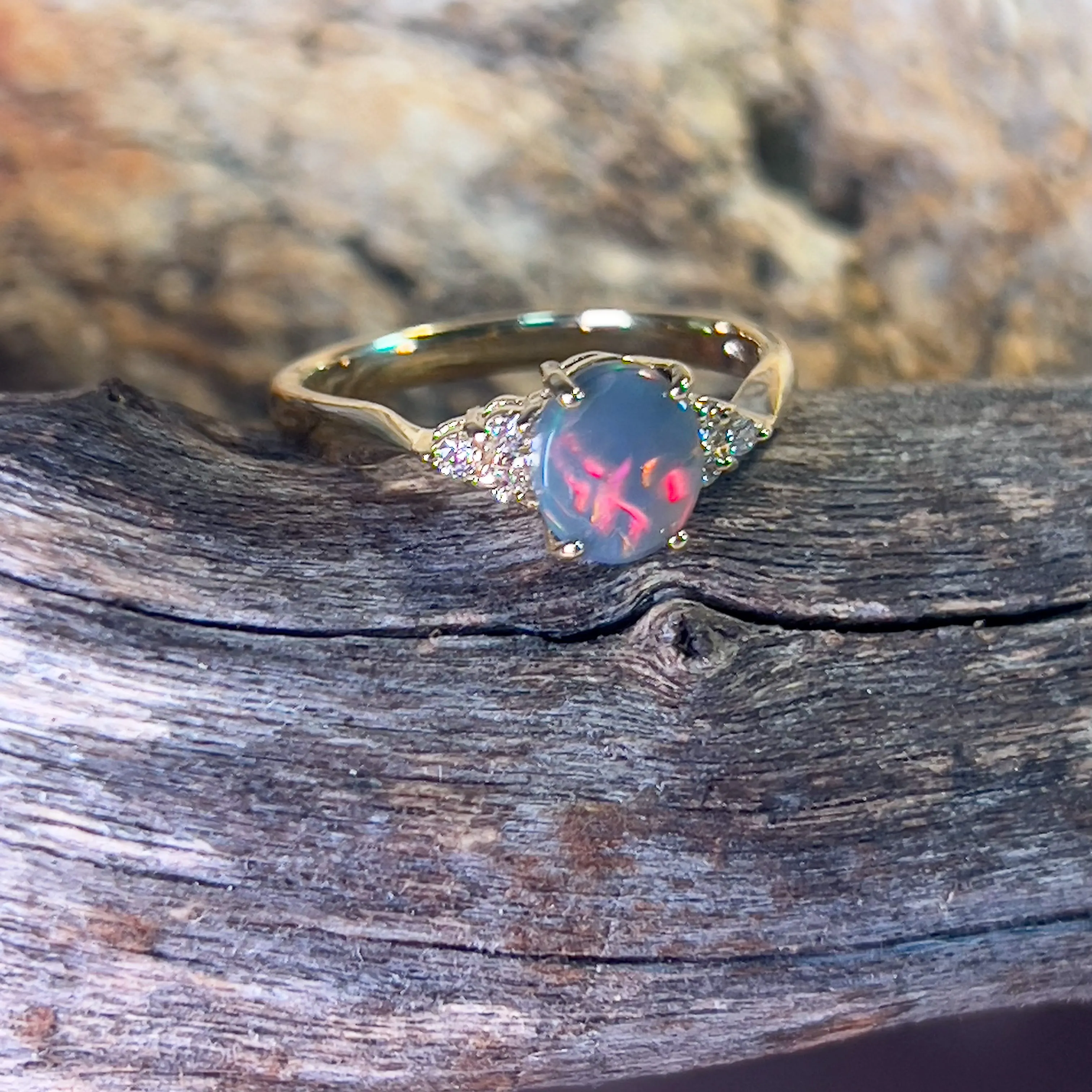 18kt Yellow Gold 1 Black Opal and 6 diamond ring