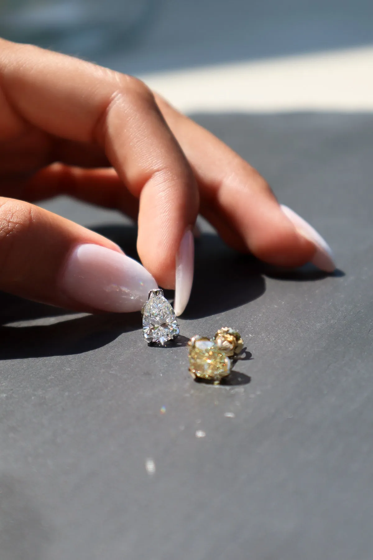 2.15 CT Luxurious Mismatched Earrings: Cushion-Cut Yellow Fancy Diamond and Pear-Shaped White Diamond