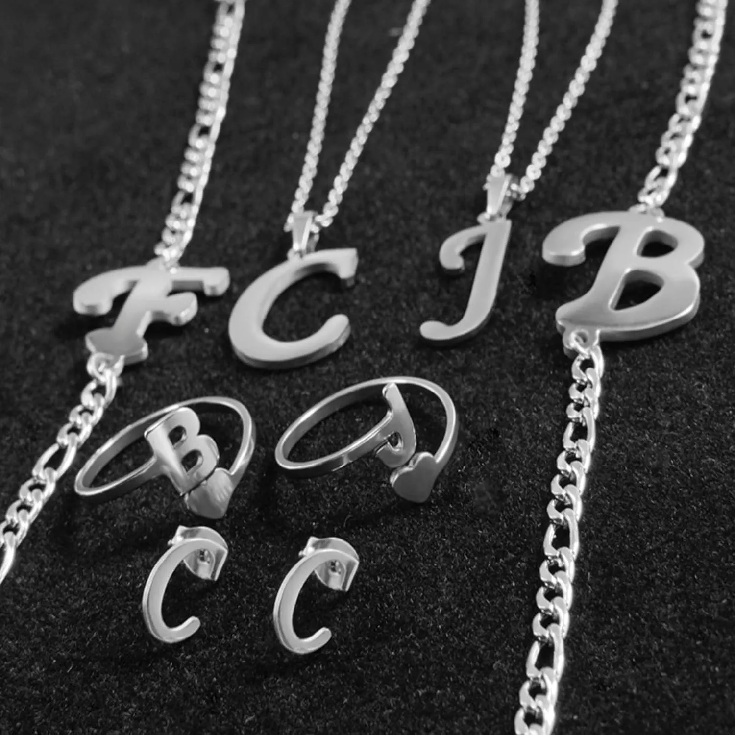 Loqimu 4 Pack Stainless Steel Initial Jewelry Sets for Women Silver Rings Bracelet Earrings Pendant Necklace Uppercase Choker Chain Ear Studs Jewelry Gift
