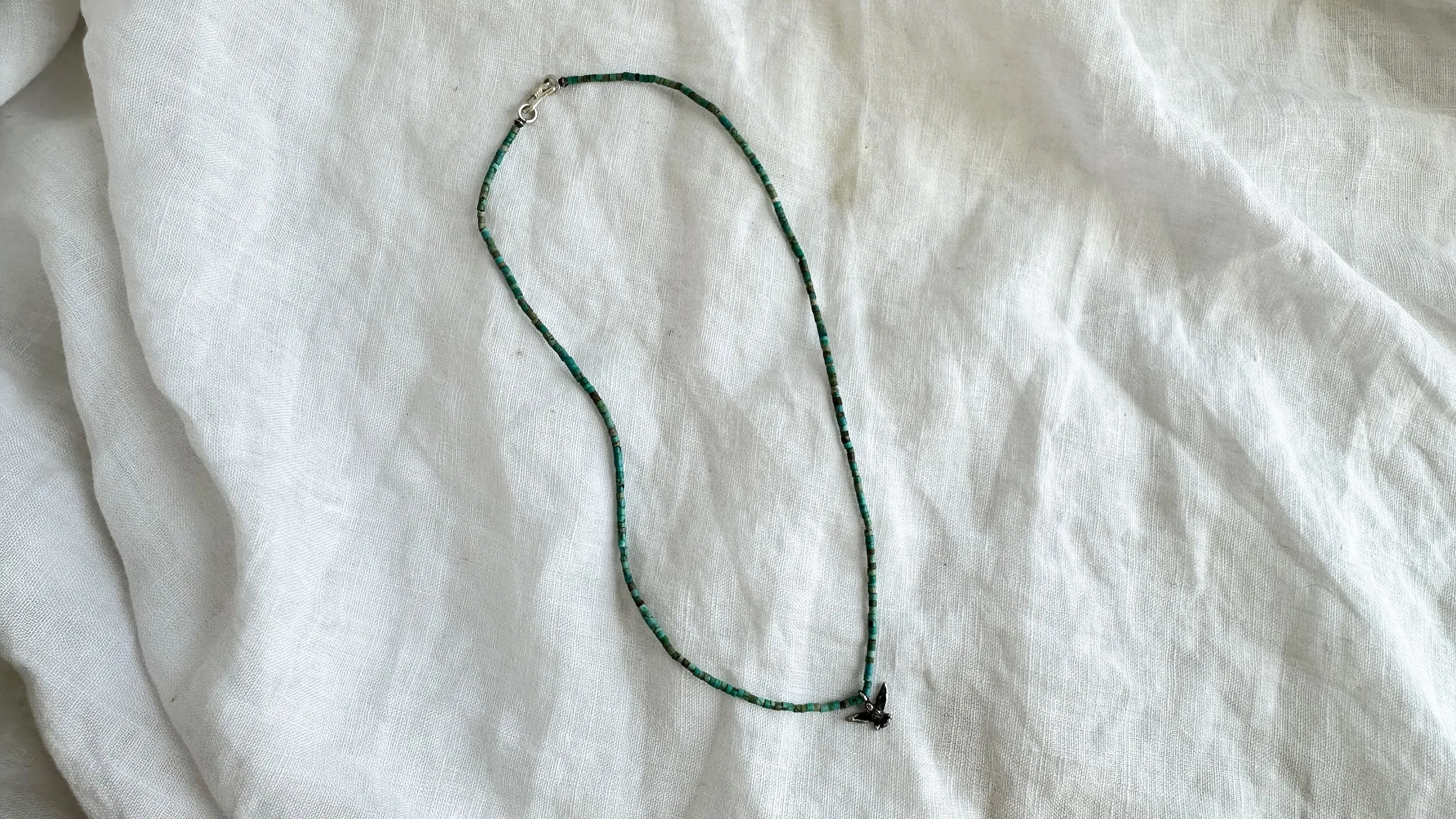 Turquoise Bird Necklace. Tiny Turquoise Heishi and Sterling Silver. 2369