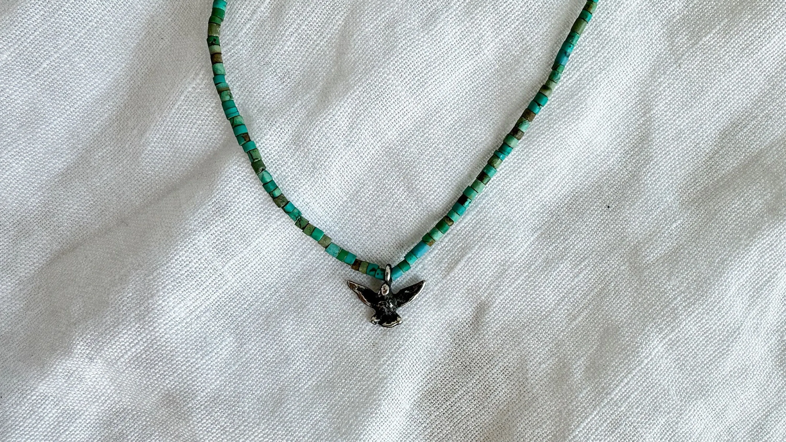 Turquoise Bird Necklace. Tiny Turquoise Heishi and Sterling Silver. 2369